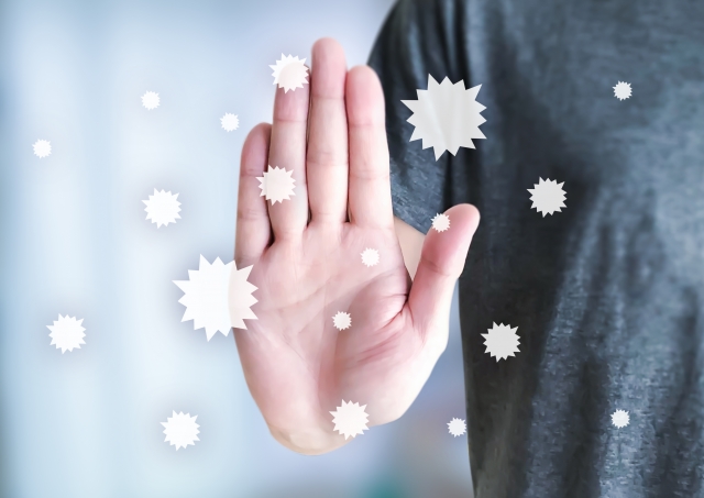 手を前に出して止める様子を示した図